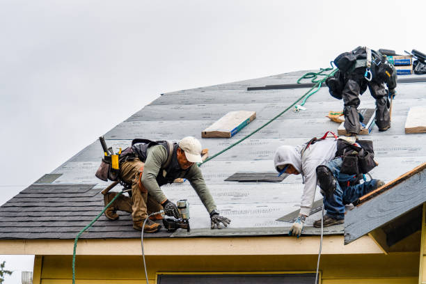 Professional Gutter Installation technician working in Manson, WA